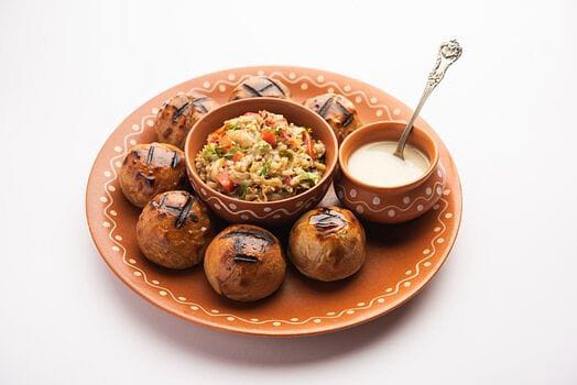 Authentic Bihari Litti Chokha with Spicy Chatni Delicious plate of Litti Chokha served with tangy chutney, representing authentic Bihari cuisine.